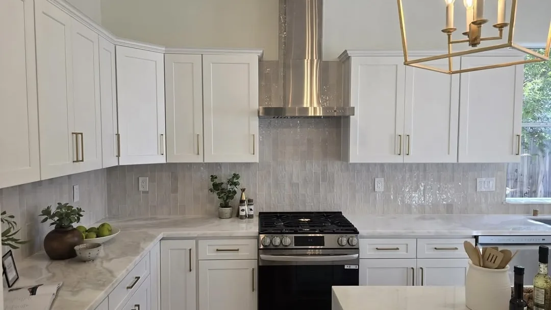 Finished kitchen with tile backsplash and quartz countertops by Quality Modern Tile